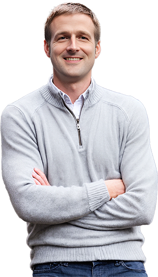 Smiling man in a light gray sweater with folded arms